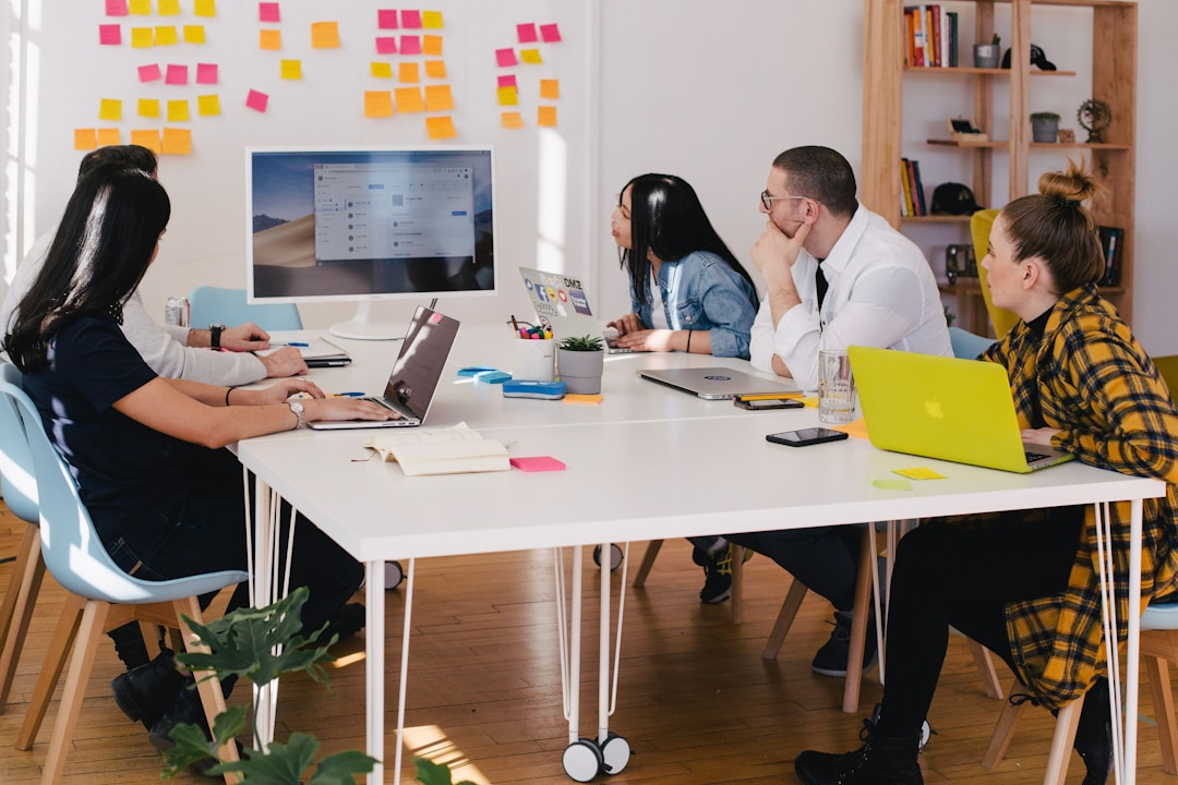 A team in an office discussing the sales cycle during a meeting