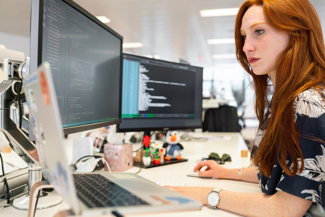 A woman in an office researching the sales cycle on her computer