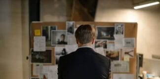 Back View of a Detective in a Black Suit