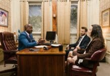 Car accident attorney consulting with a client in a modern office