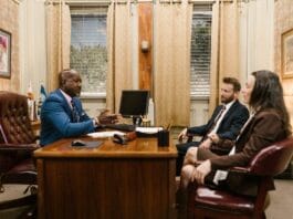 Car accident attorney consulting with a client in a modern office
