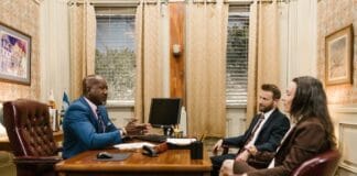 Car accident attorney consulting with a client in a modern office